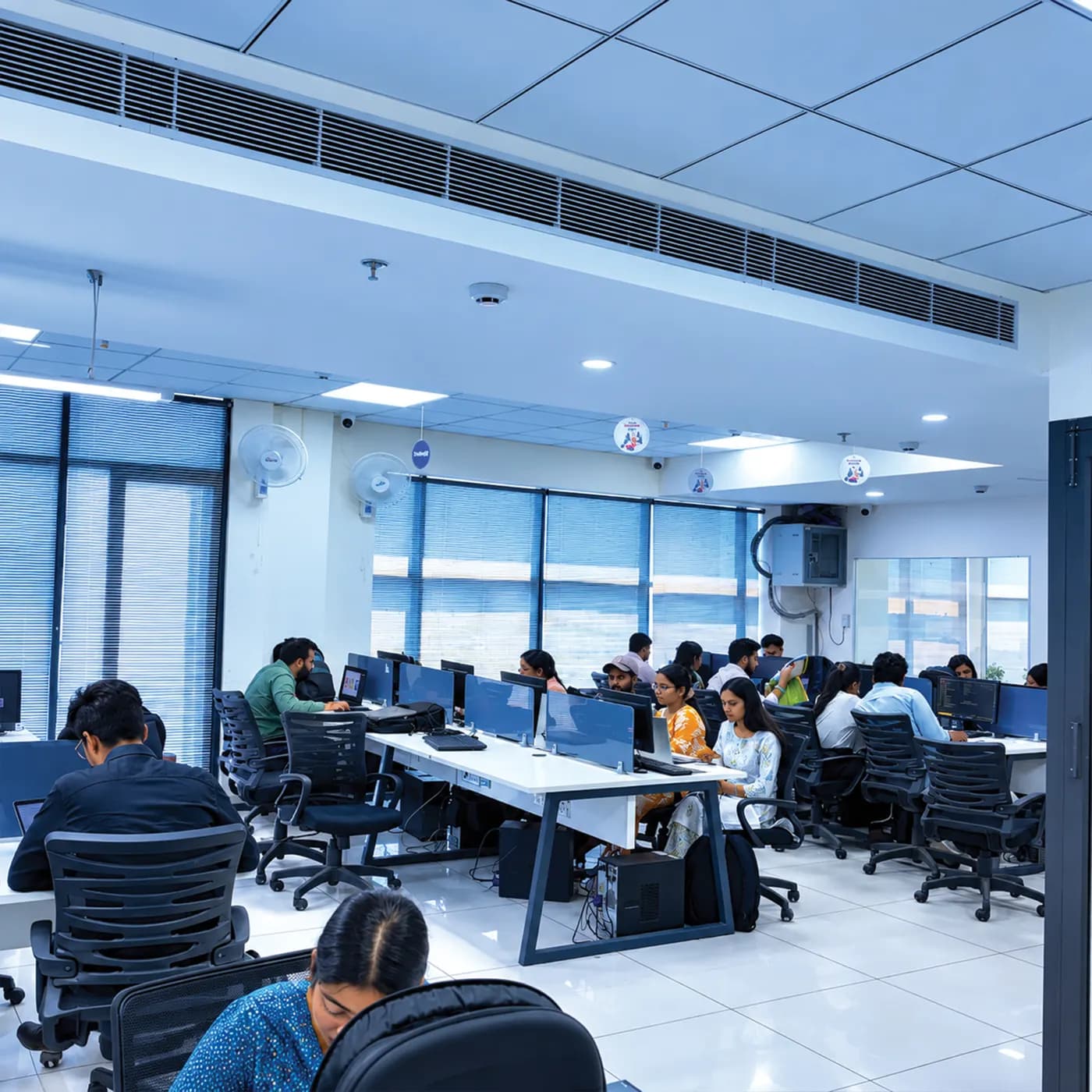 Students at workstations in the open-plan computer lab