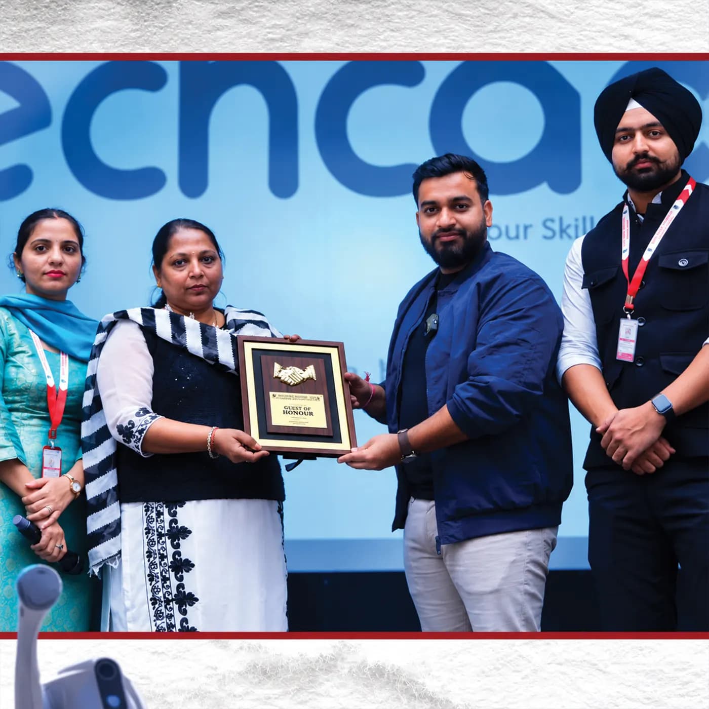 Plaque presented in front of the techcadd backdrop