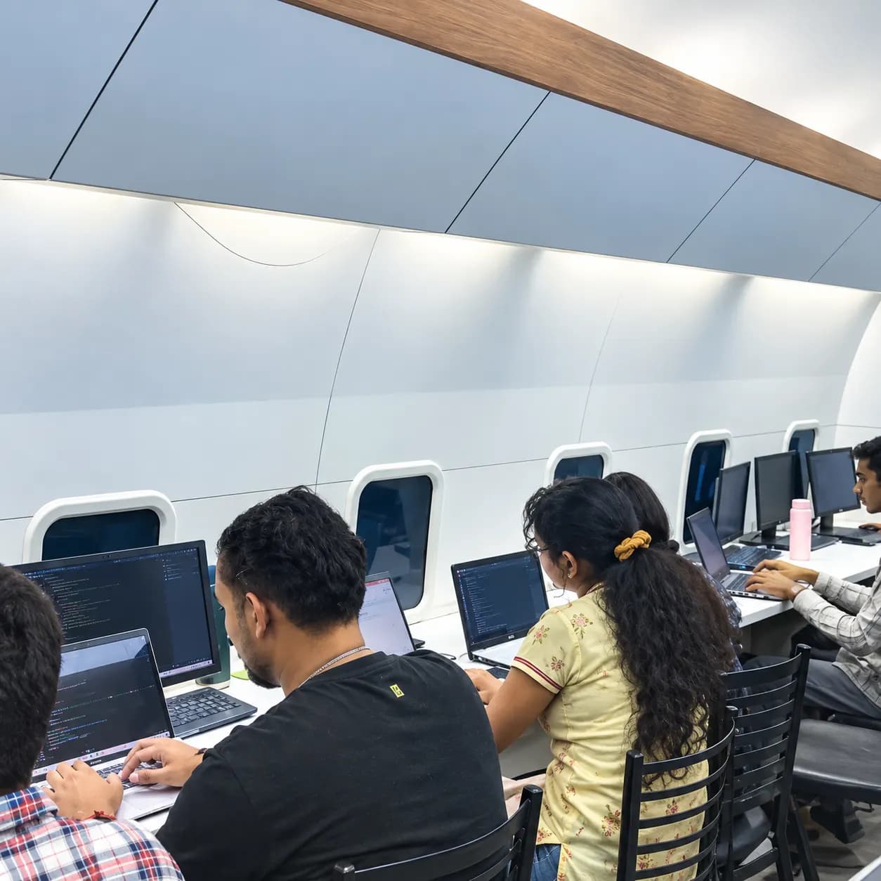 Students coding in the aircraft-cabin lab