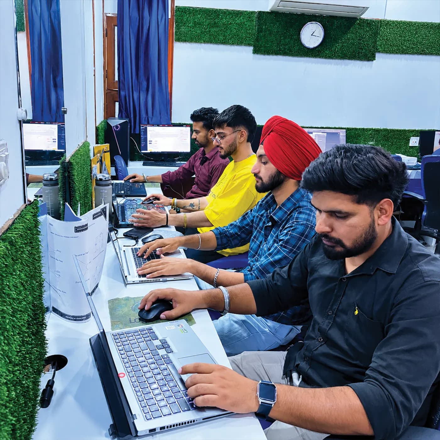 Students practising on laptops in the lab