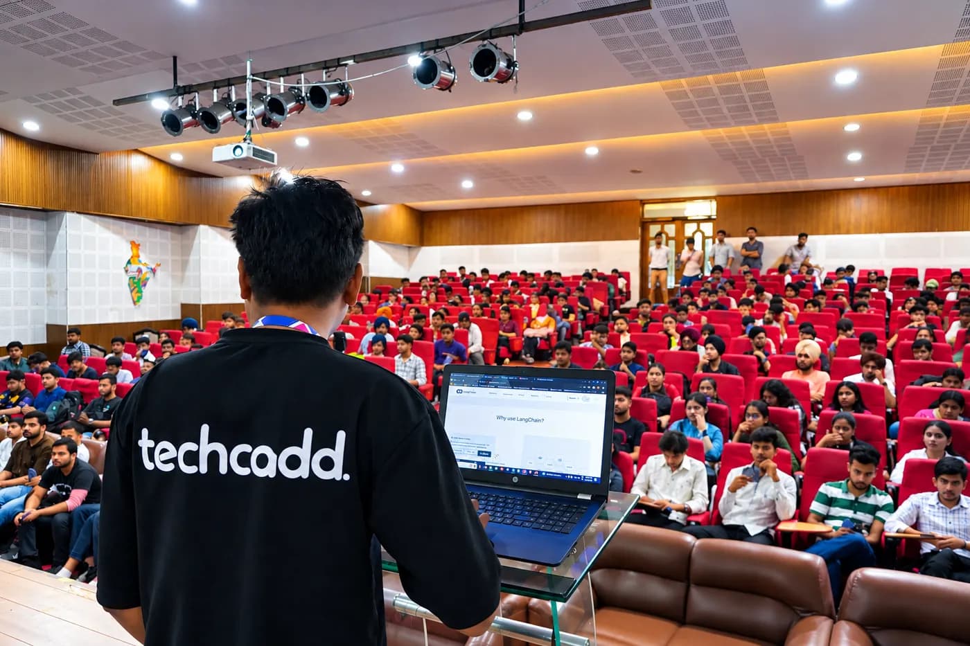 A techcadd trainer presenting a workshop to an auditorium